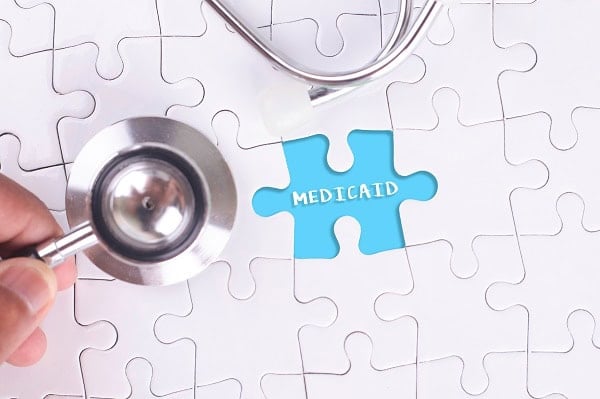 The word Medicaid in a puzzle