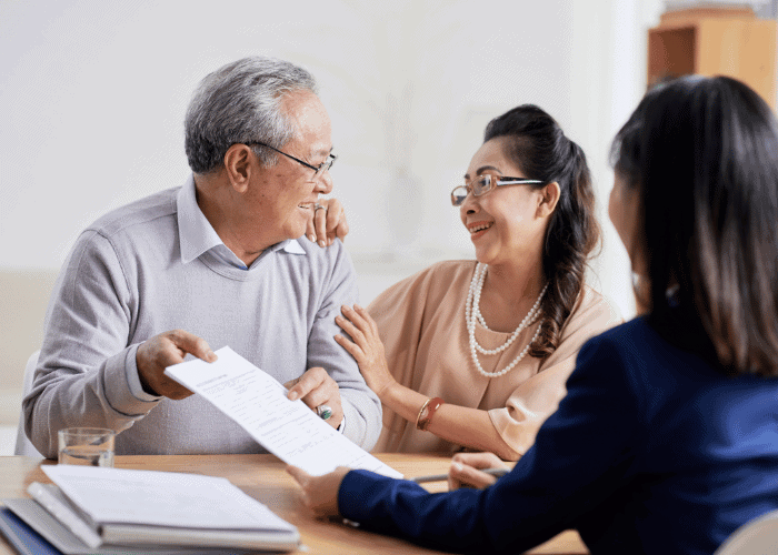 estate planning lawyer with senior couple planning for the new year
